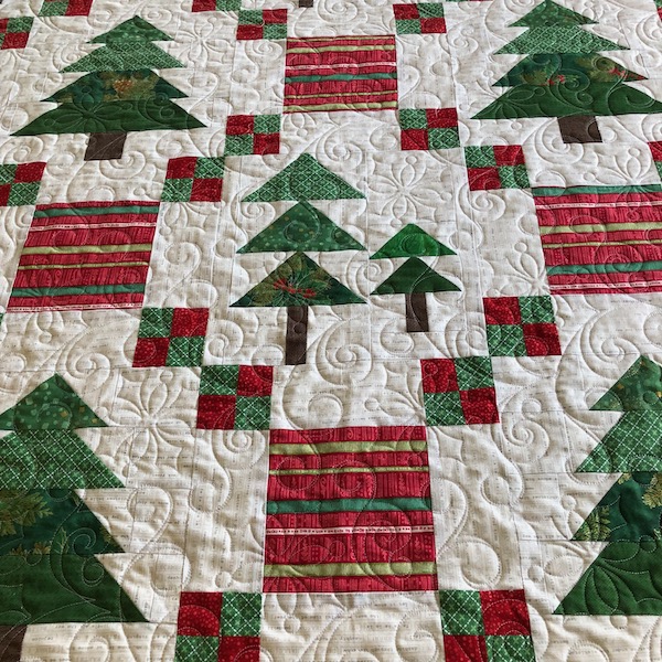 Snowflake edge to edge quilting design on Christmas tree quilt